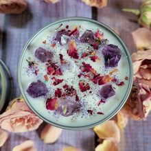 Load image into Gallery viewer, Soy candle in a tin on a wooden surface with flowers