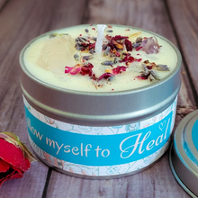 Load image into Gallery viewer, Candle in a tin with decorative elements on a wooden surface