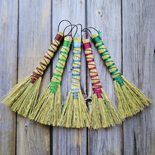 Load image into Gallery viewer, Three decorative brooms with colorful handles on a wooden surface