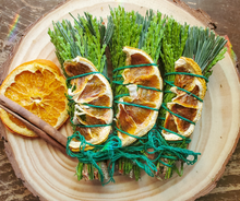 Load image into Gallery viewer, Yule Celebration smudge stick with dried orange and cinnamon
