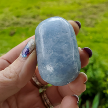 Load image into Gallery viewer, Blue calcite palm stone gemstone, ethically mined