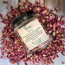 Load image into Gallery viewer, Dried rose petals in a square jar with a label against a wooden background