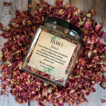 Load image into Gallery viewer, Dried rose petals in a square jar with a label against a wooden background