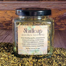 Load image into Gallery viewer, Organic dried skullcap in an apothecary jar with a label on a wooden background