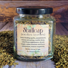 Load image into Gallery viewer, Organic dried skullcap in an apothecary jar with a label on a wooden background