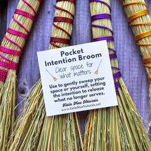Load image into Gallery viewer, Pocket intention broom with a label on a wooden background
