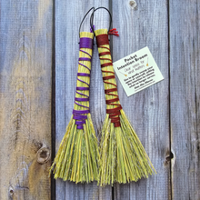 Load image into Gallery viewer, Two small brooms with colorful handles on a wooden surface, accompanied by a card.
