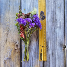 Load image into Gallery viewer, Bouquet of purple flowers with a ruler for scale on a wooden surface
