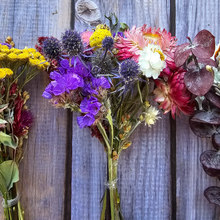 Load image into Gallery viewer, Bouquets of colorful flowers against a wooden background
