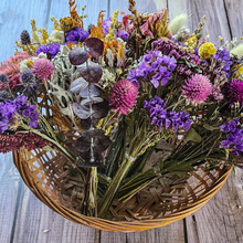Load image into Gallery viewer, Bouquet of dried flowers in a woven basket on a wooden surface
