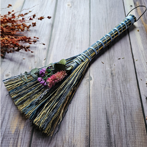 Blue small altar broom adorned with dried flowers