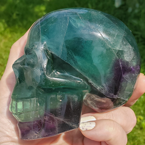 Large rainbow fluorite skull carving 