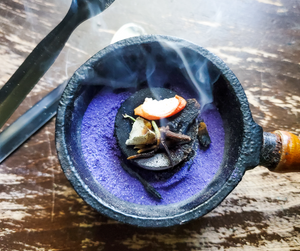 burning mabon celebration loose incense in a charcoal burner
