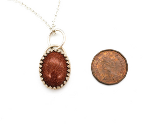 Goldstone and Sterling Silver Pendant