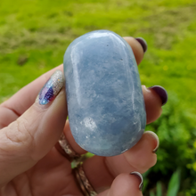 Load image into Gallery viewer, Blue calcite palm stone gemstone, ethically mined
