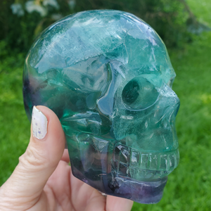 Large rainbow fluorite skull carving 