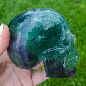 Large rainbow fluorite skull carving 