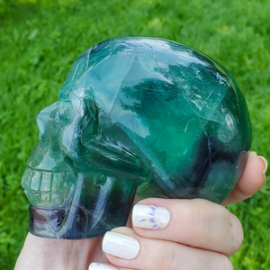 Large rainbow fluorite skull carving 