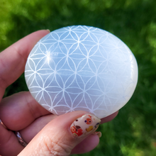 Load image into Gallery viewer, Selenite Palm Stone - Flower of Life Palm Stone
