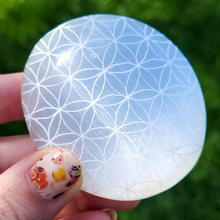 Load image into Gallery viewer, Selenite Palm Stone - Flower of Life Palm Stone
